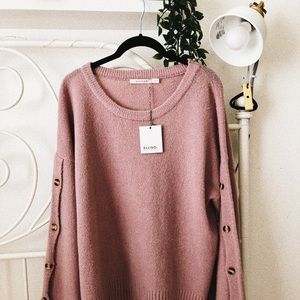 A cozy sweater with bell sleeves